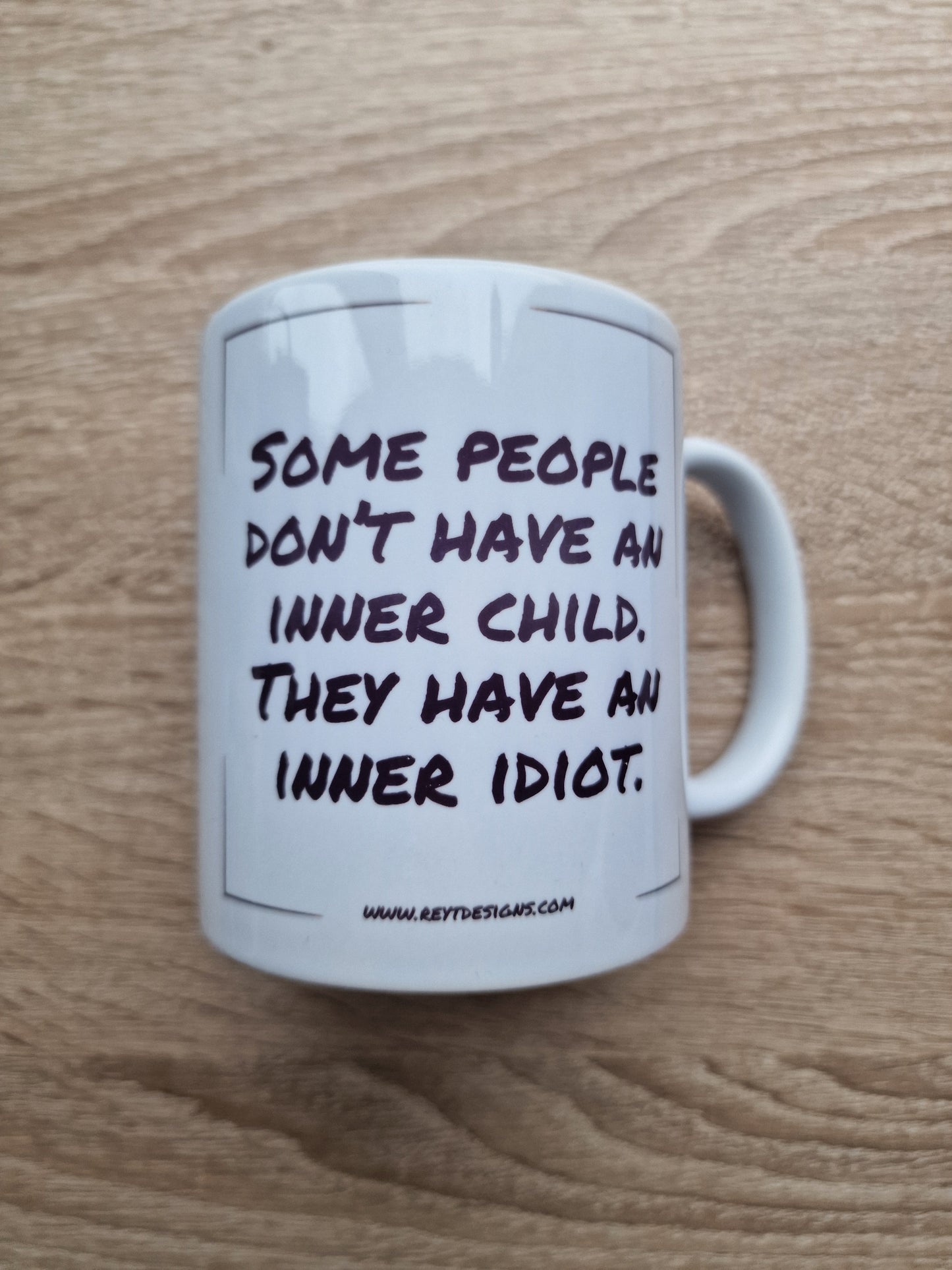 Some people don’t have an inner child. They have an inner idiot - Ceramic Mug